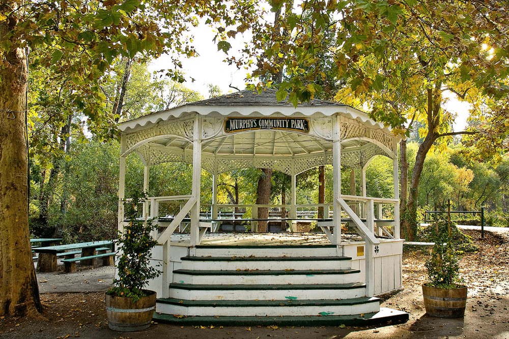 A white gazebo surrounded by trees in Murphy's Community Park.
